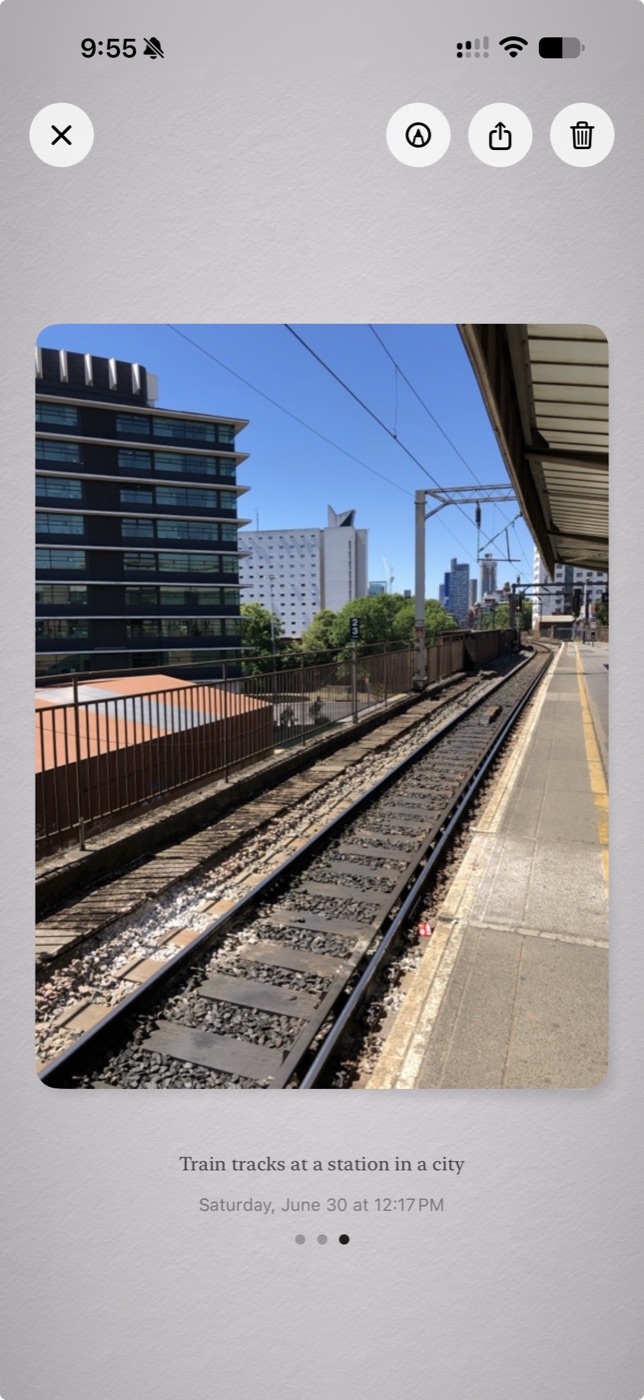 A photo in Moments captioned on device: Train tracks at a station in a city